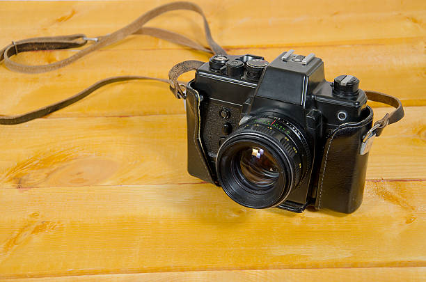 istock Old SLR camera on the wood surface 520744166