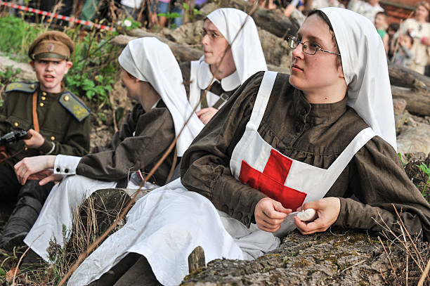 Woman in nurse uniform  during the First World War Saint-Petersburg, Russia - 15 May 2010: Reconstruction of the combat situation in 1914 the First World War. Women dressed in uniforms of the Russian army nurses. historical reenactment stock pictures, royalty-free photos & images