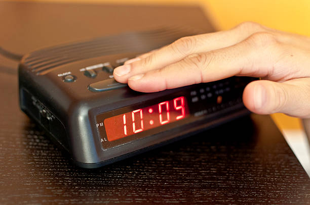 istock Snoozing the morning alarm 520745380