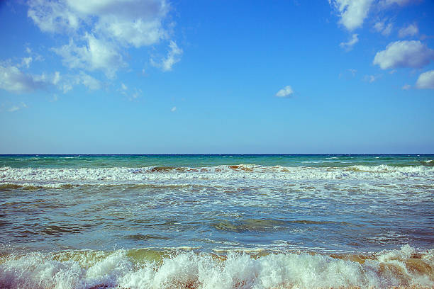 istock Beautiful wave on sea and blue sky with clouds 520746644
