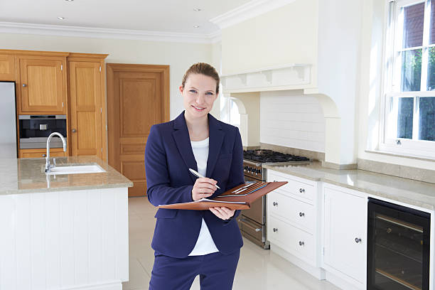 istock Real Estate Agent Looking Around Vacant New Property 520747642