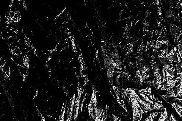 gestell aus schwarzem kunststoff, müll material als hintergrund - garbage bag garbage bag plastic stock-fotos und bilder