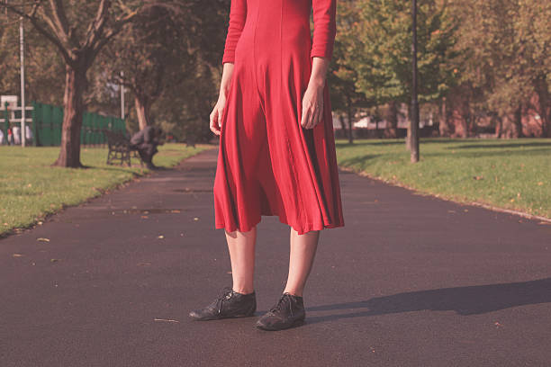 istock Young woman walking in the park 520752987