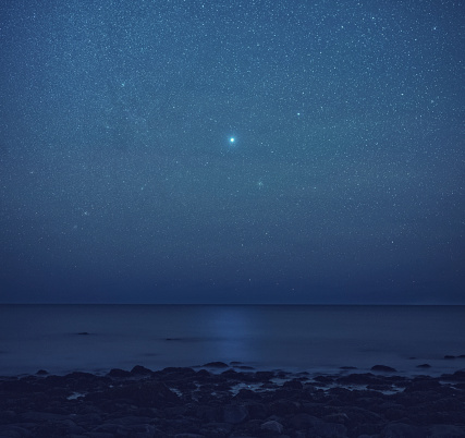 Sirius, 'The Dog Star', is reflected in the open Atlantic.  Long exposure.