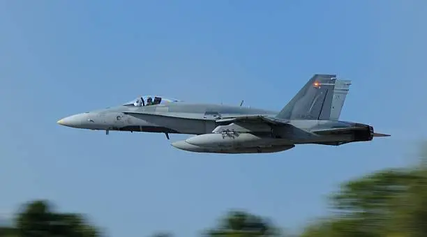 A F-18 Fighter Jet in low altitude flight.