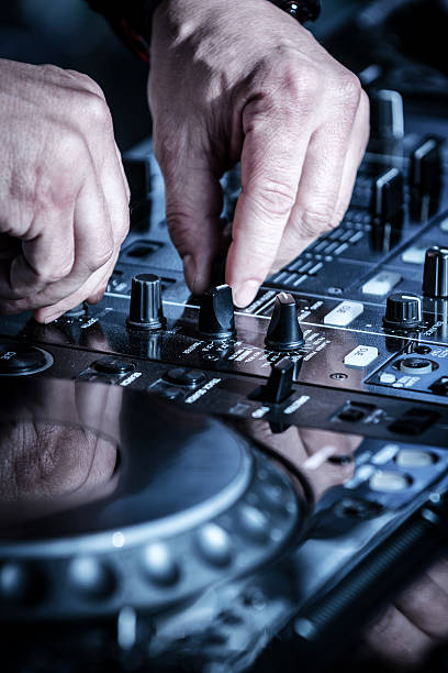 istock DJ mixing music at party 520757243