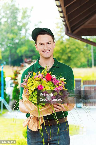 Delivery Man Delivering Flowers Stock Photo - Download Image Now - Adult, Adults Only, Birthday