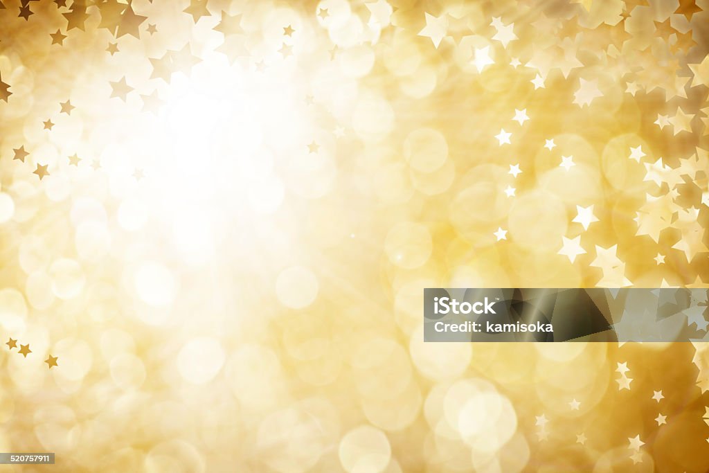 Gold Defocused Light Background For Christmas With Stars Backgrounds Stock Photo