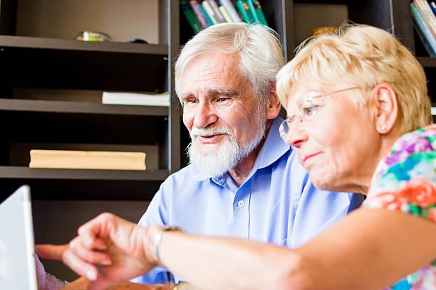istock Senior couple looking something on digital tablet. 520757937