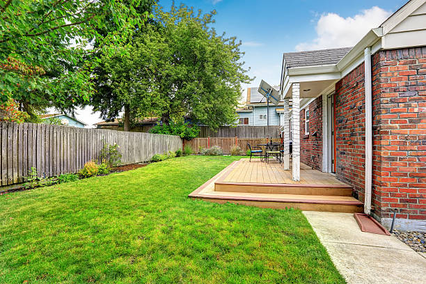 istock Brick house exterior with walkout wooden deck 520758165