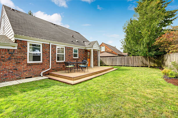 istock Brick house exterior with walkout wooden deck 520758193