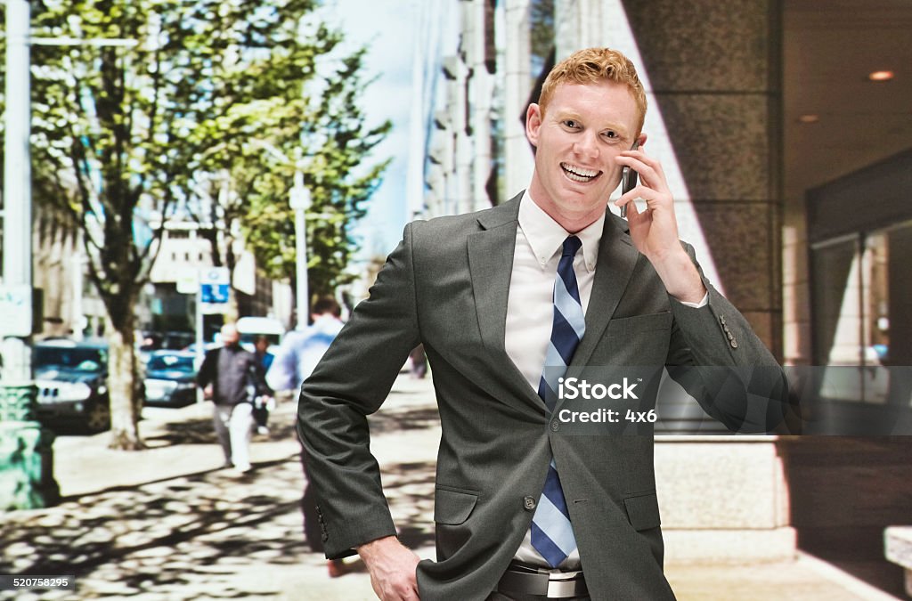 Businessman outdoors and talking on the phone Businessman in outdoors and talking on the phonehttp://www.twodozendesign.info/i/1.png 20-29 Years Stock Photo