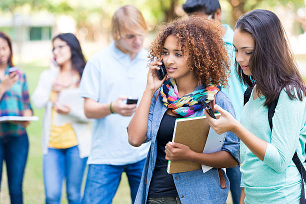 istock Teen college student talking on smart phone while on campus 520758539