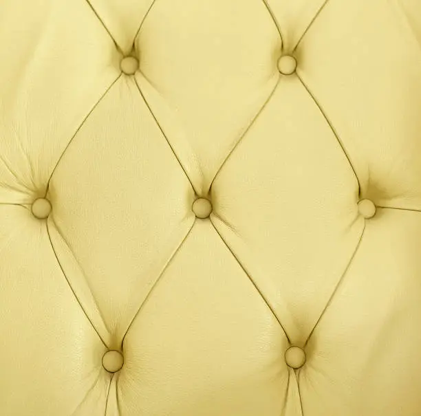 Leather upholstery of a leather armchair. Close-up or macro shot.