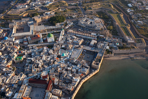Photo from above of the old city of Akko with He-Hafir Garden view, Israel at sunrise.