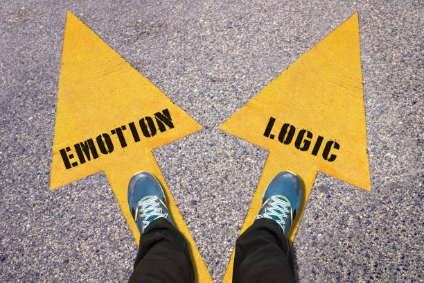 istock Feet and words Emotion and Logic painted on road 520766668