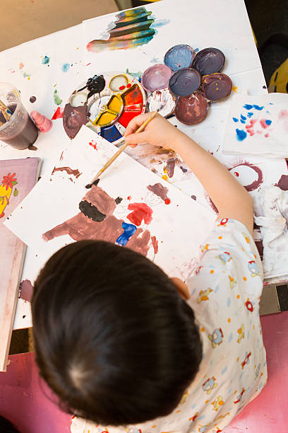 istock Baby boy learning by painting with brush. 520767622