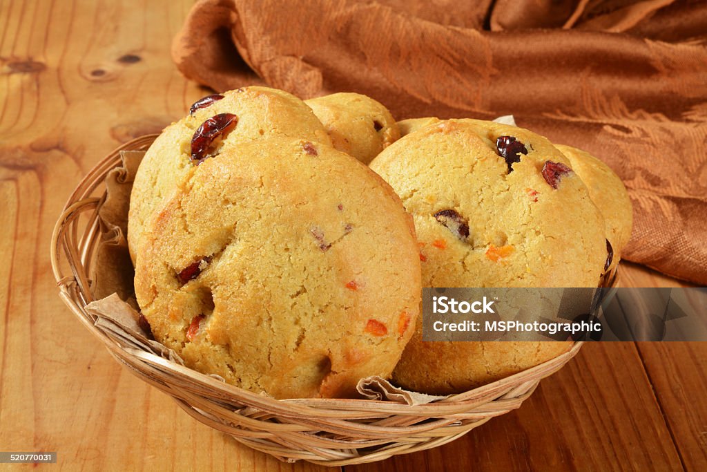 Cranberry orange cookies A basket of cranberry orange cookies on a rustic wooden table Baked Stock Photo