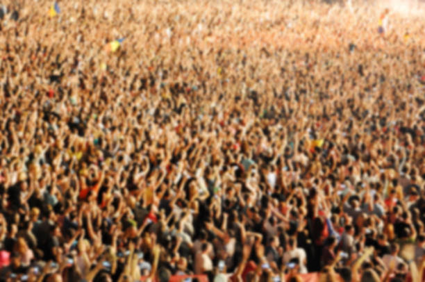 istock Blurred crowd of people partying 520770064