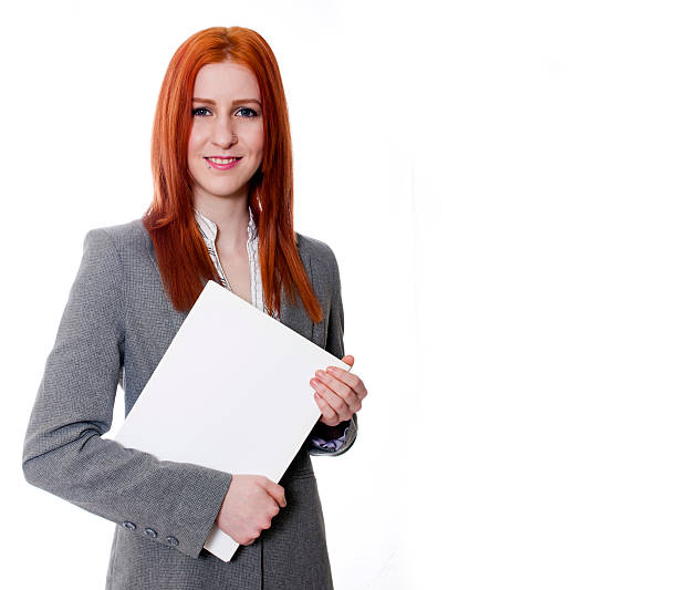 Young business woman on white background holding white folder stock photo