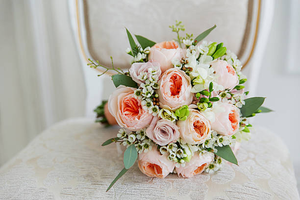istock Wedding bouquet on chair. Bride's traditional symbolic accessory. 520771846