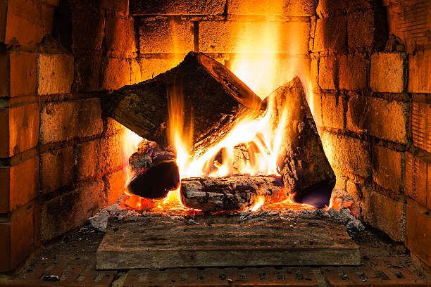 istock burning wood in fire-box of fireplace 520772168