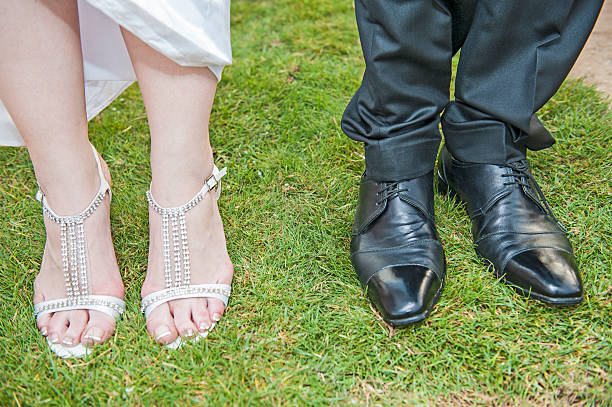 istock Bride and grooms feet at a wedding 520772577