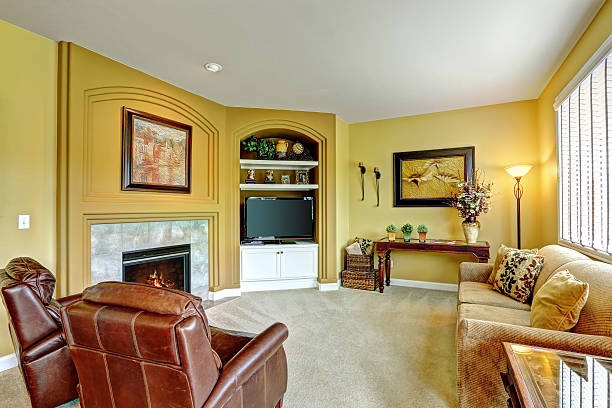 istock Cozy living room with fireplace and leather armchairs 520773107