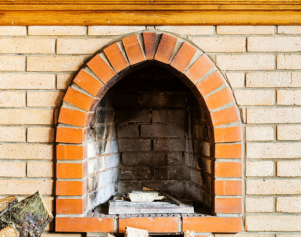 istock fire-box of not kindled brick fireplace 520773144