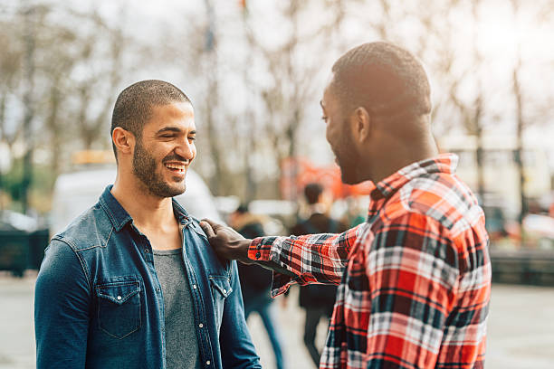 istock Two young men meeting in the city 520773784