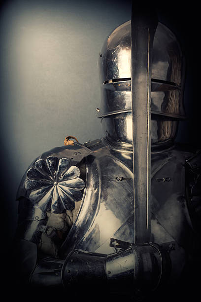 istock knight wearing armor and holding two-handed sword 520773955