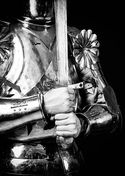 istock knight wearing armor and holding two-handed sword 520774097