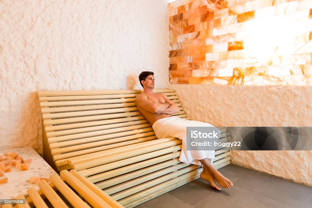 Man in a salt room Young man relaxing in a salt room in the spa Salt - Mineral Stock Photo