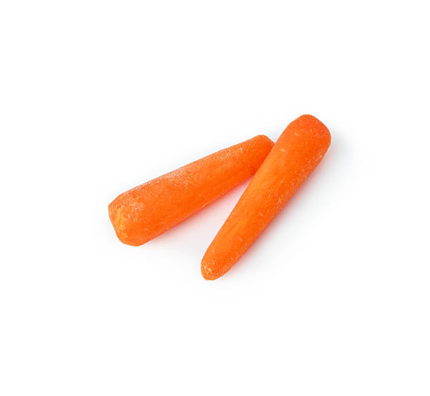 istock Fresh baby carrots isolated 520774807