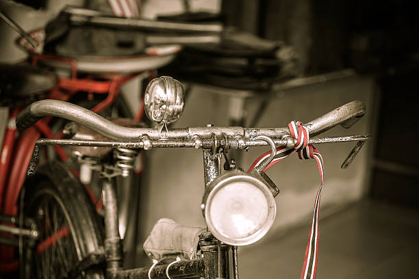 Old rusty vintage bicycle near the concrete wall. stock photo