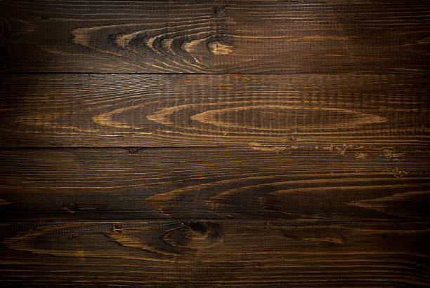 istock Closeup texture of dark wooden planks. Horizontal background wit 520775040