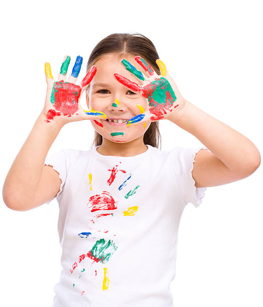 istock Cute girl playing with paints 520775597