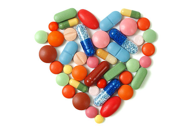 Heart pills stock photo