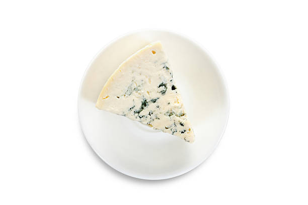 cheese on a white plate cheese on a white plate,  on white backgtound roquefort cheese stock pictures, royalty-free photos & images