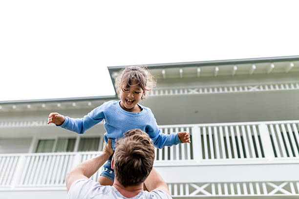 istock Father and daughter playing together at home 520779418
