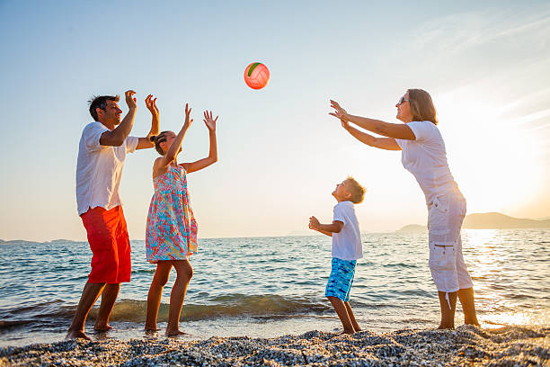 istock Family play on beach 520780210