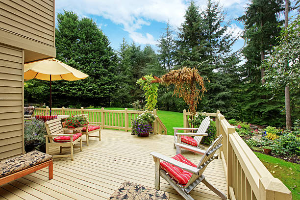 istock Spacious walkout deck with patio area and chairs 520785971