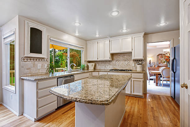 istock Kitchen room with white storage combination and island 520785985