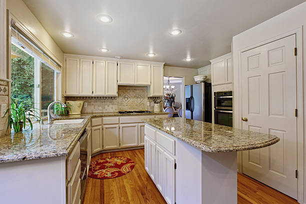 istock Kitchen room with white storage combination and island 520785991