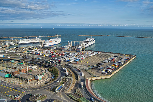 View at Dover port with ferries and lorries in sight.