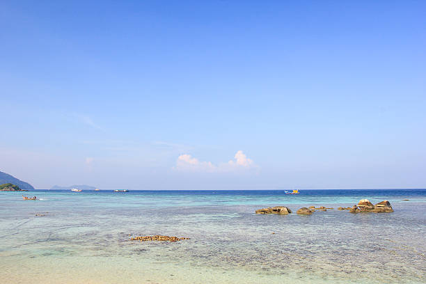 istock Rocks , sea and blue sky - Lipe island Thailand 520786491