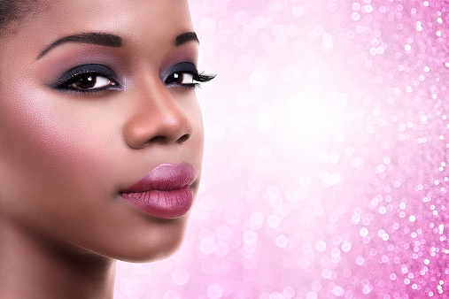 Beautiful African American woman makeup lipstick