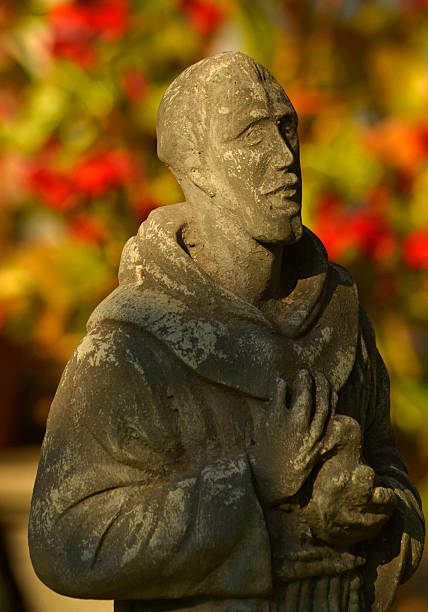 Saint Francis statue in the garden stock photo