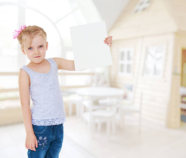 istock Charming little girl playing. 520792249