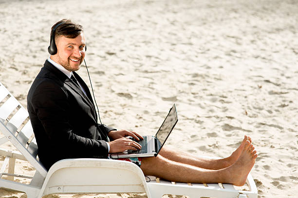 istock Businessman on the beach 520792569